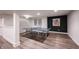 Spacious basement rec room features a ping pong table and black accent wall with unique artwork at 12725 Parsons Gate, Carmel, IN 46032