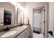 Bright bathroom with double vanity, granite countertops, and a separate shower/tub with modern fixtures at 12725 Parsons Gate, Carmel, IN 46032
