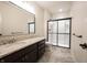 Bathroom features granite countertop, sleek mirror, and glass enclosed shower at 12725 Parsons Gate, Carmel, IN 46032