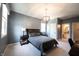 Comfortable bedroom featuring a plush bed, soft lighting, and a glimpse into the ensuite bathroom, creating a restful retreat at 12725 Parsons Gate, Carmel, IN 46032