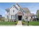 Beautiful two-story home with a professionally landscaped front yard and charming exterior at 12725 Parsons Gate, Carmel, IN 46032
