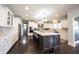This home has a large kitchen with granite counters and seating at the island at 12725 Parsons Gate, Carmel, IN 46032