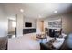 Inviting living room with a modern TV setup, stylish furniture, and an open layout perfect for entertaining guests at 12725 Parsons Gate, Carmel, IN 46032
