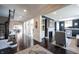 Open-concept living area with hardwood flooring, a fireplace, and stylish furniture at 12725 Parsons Gate, Carmel, IN 46032