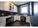 Functional home office with custom cabinetry, built-in desks, and lots of natural light at 12725 Parsons Gate, Carmel, IN 46032
