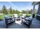 Outdoor patio with comfortable seating surrounding a center table, perfect for relaxation and entertaining at 12725 Parsons Gate, Carmel, IN 46032