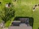 Aerial shot of backyard with a deck featuring outdoor furniture and a playset at 16016 Viking Lair Rd, Westfield, IN 46074