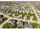 Comprehensive aerial view of residential community, highlighting street pattern, varied homes, and green spaces at 16016 Viking Lair Rd, Westfield, IN 46074
