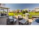 Relaxing backyard deck with outdoor seating, stainless steel grill, and beautiful green backyard at 16016 Viking Lair Rd, Westfield, IN 46074