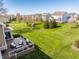 Backyard featuring a deck with outdoor furniture and large grassy area with a playset at 16016 Viking Lair Rd, Westfield, IN 46074