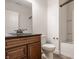 Bathroom with a dark countertop vanity, toilet, and shower with a white shower curtain at 16016 Viking Lair Rd, Westfield, IN 46074