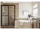 Well-lit bathroom featuring a large walk-in shower, soaking tub, and decorative accents at 16016 Viking Lair Rd, Westfield, IN 46074
