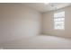 Empty bedroom with neutral carpet and a large window for natural light at 16016 Viking Lair Rd, Westfield, IN 46074