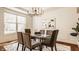 Dining room with large window, chandelier, and six chairs at 16016 Viking Lair Rd, Westfield, IN 46074