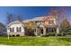 Charming two-story home featuring manicured lawn, brick accents, and vibrant landscaping at 16016 Viking Lair Rd, Westfield, IN 46074