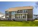 Exterior view of a well-maintained home with a green yard and multi-level deck at 16016 Viking Lair Rd, Westfield, IN 46074