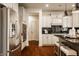 Bright kitchen with stainless steel appliances and sleek countertops at 16016 Viking Lair Rd, Westfield, IN 46074