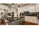 Modern kitchen with a large island and stainless steel appliances at 16016 Viking Lair Rd, Westfield, IN 46074