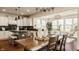 Open concept kitchen with white cabinets, black countertops and adjacent dining area at 16016 Viking Lair Rd, Westfield, IN 46074
