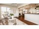 Open-concept living room with access to deck, hardwood floors, and neutral decor at 16016 Viking Lair Rd, Westfield, IN 46074