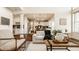 Open concept living room with hardwood floors, fireplace, and view into kitchen at 16016 Viking Lair Rd, Westfield, IN 46074