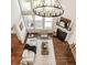 Bright living room featuring high ceilings, modern lighting, and a cozy fireplace at 16016 Viking Lair Rd, Westfield, IN 46074