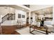 Spacious living room with hardwood floors and staircase to the second floor at 16016 Viking Lair Rd, Westfield, IN 46074