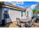 Outdoor living on the back deck with patio furniture and scenic backyard views at 1649 Woodfield Dr, Greenwood, IN 46143