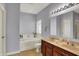 Bright bathroom features a double sink vanity, soaking tub, and a large mirror at 1649 Woodfield Dr, Greenwood, IN 46143