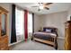 Well-lit bedroom features a comfortable bed and ample natural light from the windows at 1649 Woodfield Dr, Greenwood, IN 46143