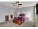 Comfortable primary bedroom featuring soft carpeting and ensuite bathroom at 1649 Woodfield Dr, Greenwood, IN 46143