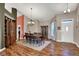 Elegant dining room featuring a classic chandelier and hardwood floors, ideal for formal dinners at 1649 Woodfield Dr, Greenwood, IN 46143
