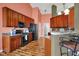 Modern kitchen with wood cabinets, breakfast bar, and new appliances at 1649 Woodfield Dr, Greenwood, IN 46143