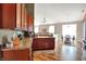 Well-lit eat-in kitchen featuring wood cabinets and stainless steel appliances at 1649 Woodfield Dr, Greenwood, IN 46143