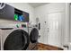 Functional laundry room equipped with modern washer and dryer units for convenience at 1649 Woodfield Dr, Greenwood, IN 46143