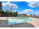 Community pool offering a refreshing recreational space, with lounge chairs and a playground nearby at 1649 Woodfield Dr, Greenwood, IN 46143