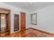 Hardwood floors featured in a bedroom with neutral walls and wood trim at 1726 N Euclid Ave, Indianapolis, IN 46218