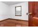 Bedroom with hardwood floors, window and white walls shown at 1726 N Euclid Ave, Indianapolis, IN 46218