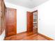 Bedroom with hardwood floors and wood trim throughout the room at 1726 N Euclid Ave, Indianapolis, IN 46218