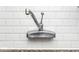 Close up of a delta faucet set against a white tile backsplash and speckled granite countertop at 1726 N Euclid Ave, Indianapolis, IN 46218
