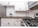 Modern kitchen featuring a stainless steel gas range and granite countertop at 1726 N Euclid Ave, Indianapolis, IN 46218