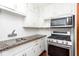 Bright kitchen featuring modern stainless steel appliances and granite countertops at 1726 N Euclid Ave, Indianapolis, IN 46218