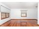 Living room featuring gleaming hardwood floors and abundant natural light at 1726 N Euclid Ave, Indianapolis, IN 46218