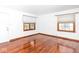 Bright and spacious living room with gleaming hardwood floors and natural light at 1726 N Euclid Ave, Indianapolis, IN 46218