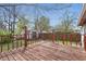 Spacious back deck with wood railings, overlooking a grassy yard and storage shed at 1819 S Drexel Ave, Indianapolis, IN 46203