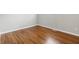 Bright bedroom features hardwood floors and neutral paint, creating a serene and inviting space at 1819 S Drexel Ave, Indianapolis, IN 46203