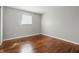 Bright bedroom featuring hardwood floors, neutral paint and ample natural light, perfect for relaxation and rest at 1819 S Drexel Ave, Indianapolis, IN 46203