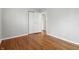 This bedroom features a closet, neutral paint, and hardwood floors, providing a comfortable space at 1819 S Drexel Ave, Indianapolis, IN 46203
