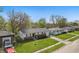 Aerial view of single-Gathering homes on a tree-lined street with lawns and driveways at 1819 S Drexel Ave, Indianapolis, IN 46203