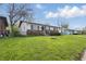 Charming single-story home with brick and white siding, complemented by a well-maintained front yard at 1819 S Drexel Ave, Indianapolis, IN 46203
